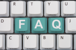 computer keyboard with FAQ keys highlighted in turqoise