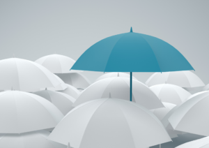 Prominent turqoise umbrella standing tall against white umbrellas