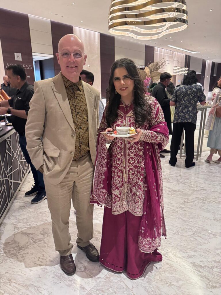 Male and female in formal wear smiling into camera