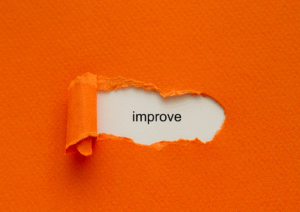 Orange envelope with a small tear showing the word improve