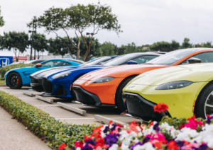 Image showing brightly coloured cars lined up in a row