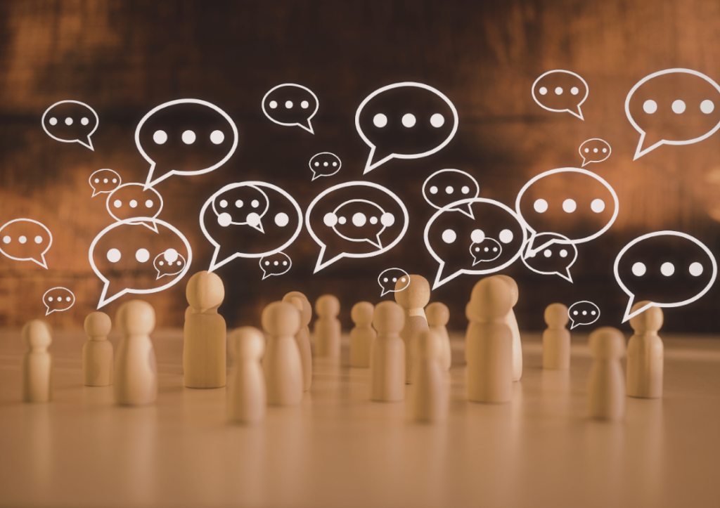 Graphic showing questionmarks over wooen pegs that represent a group of people