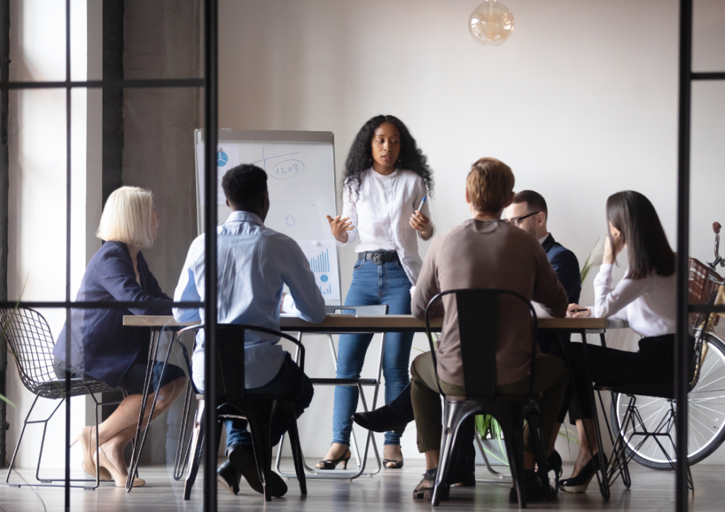 Group of people in an office having a conversation