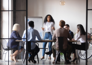Group of people in an office having a conversation