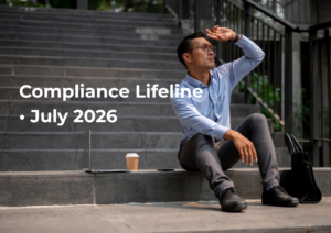 Male sitting on steps wearing business wear looking into distance shielding eyes from sun