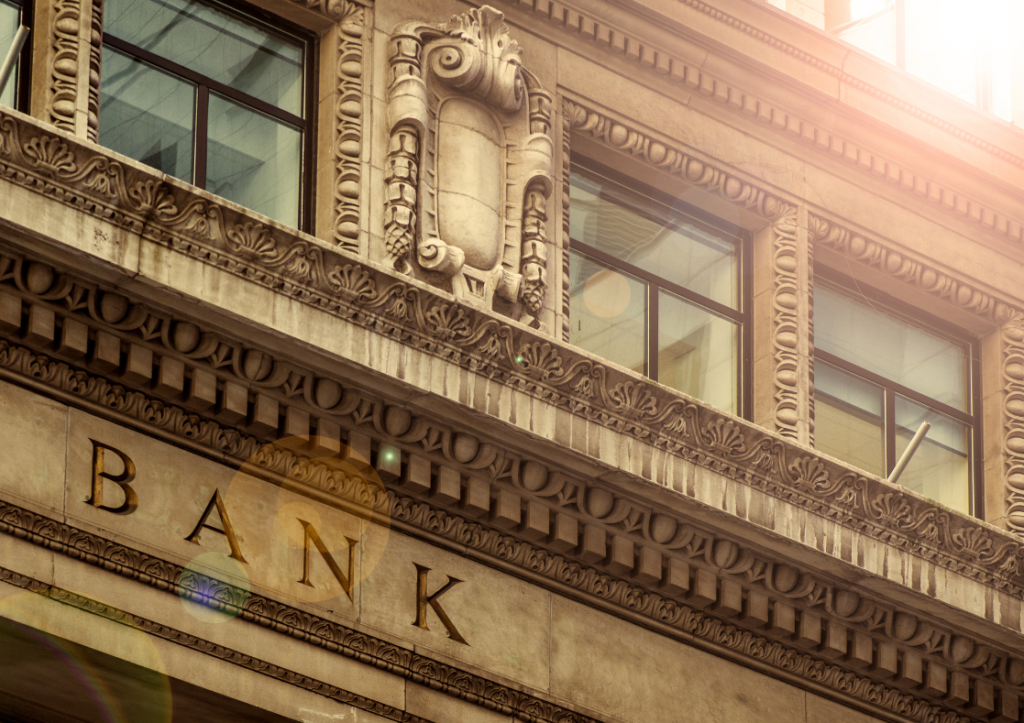 Image of the outside of a traditional building with the word bank etched into the stone fascia