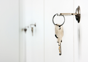 A key hanging from a filing cupboard suggesting legal privilege
